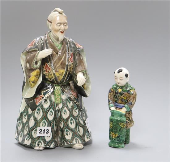 A Japanese Kutani figure of a Samurai general and a figure of a boy tallest 31cm